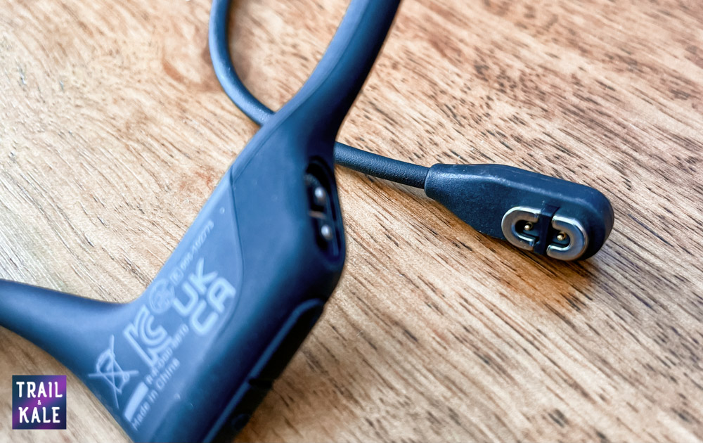 Aftershokz Review OpenRun Pro charging port Trail and Kale web wm 1