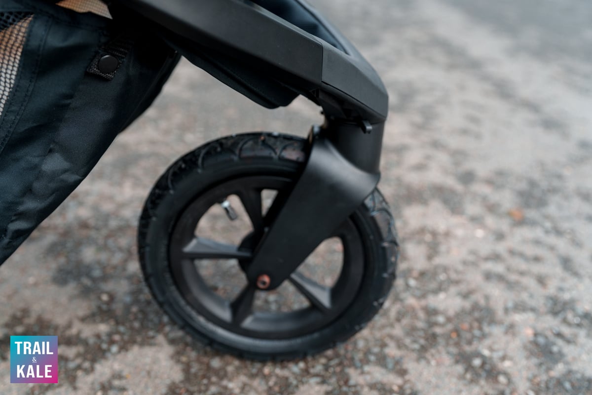 The front wheel easily locks in place or releases to swivel 360, by flicking the small plastic lever.