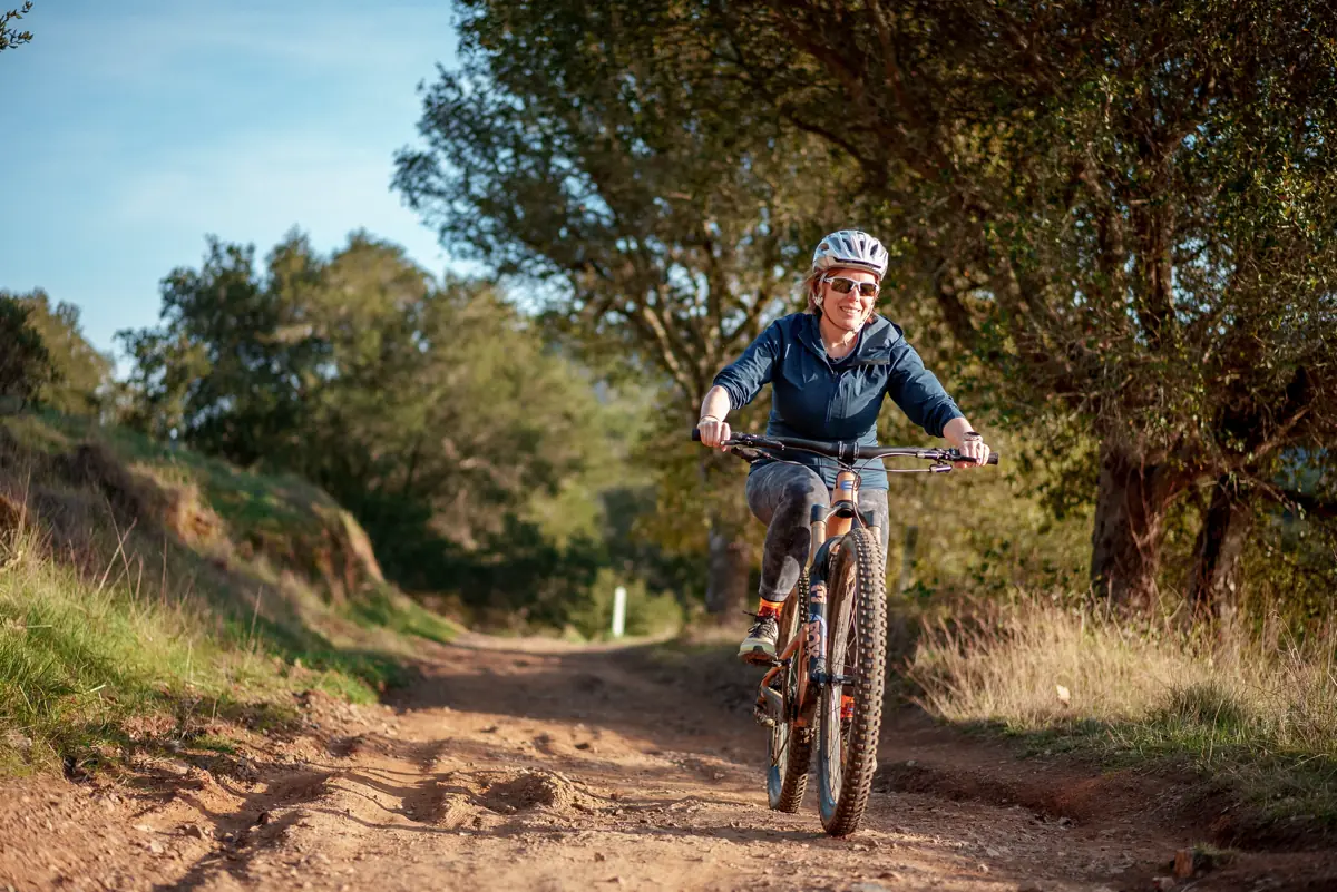 Helen really appreciates having a carbon frame mountain bike as it’s much easier for her to get it on our bike rack herself