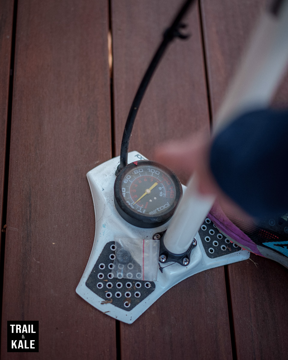 Decent bike pumps that have a built-in pressure gauge will tell you what the current tire pressure is when you connect it to your valve.