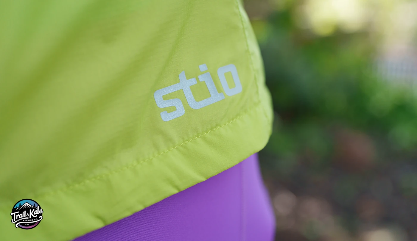 Reflective Stio logo on the Second Light windshell jacket