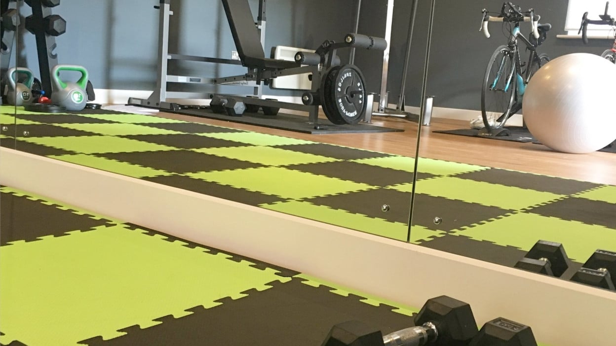Home gym fitness equipment with weights and mats